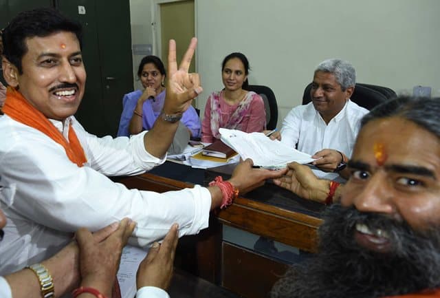 BJP Leader Rathore With Baba Ramdev